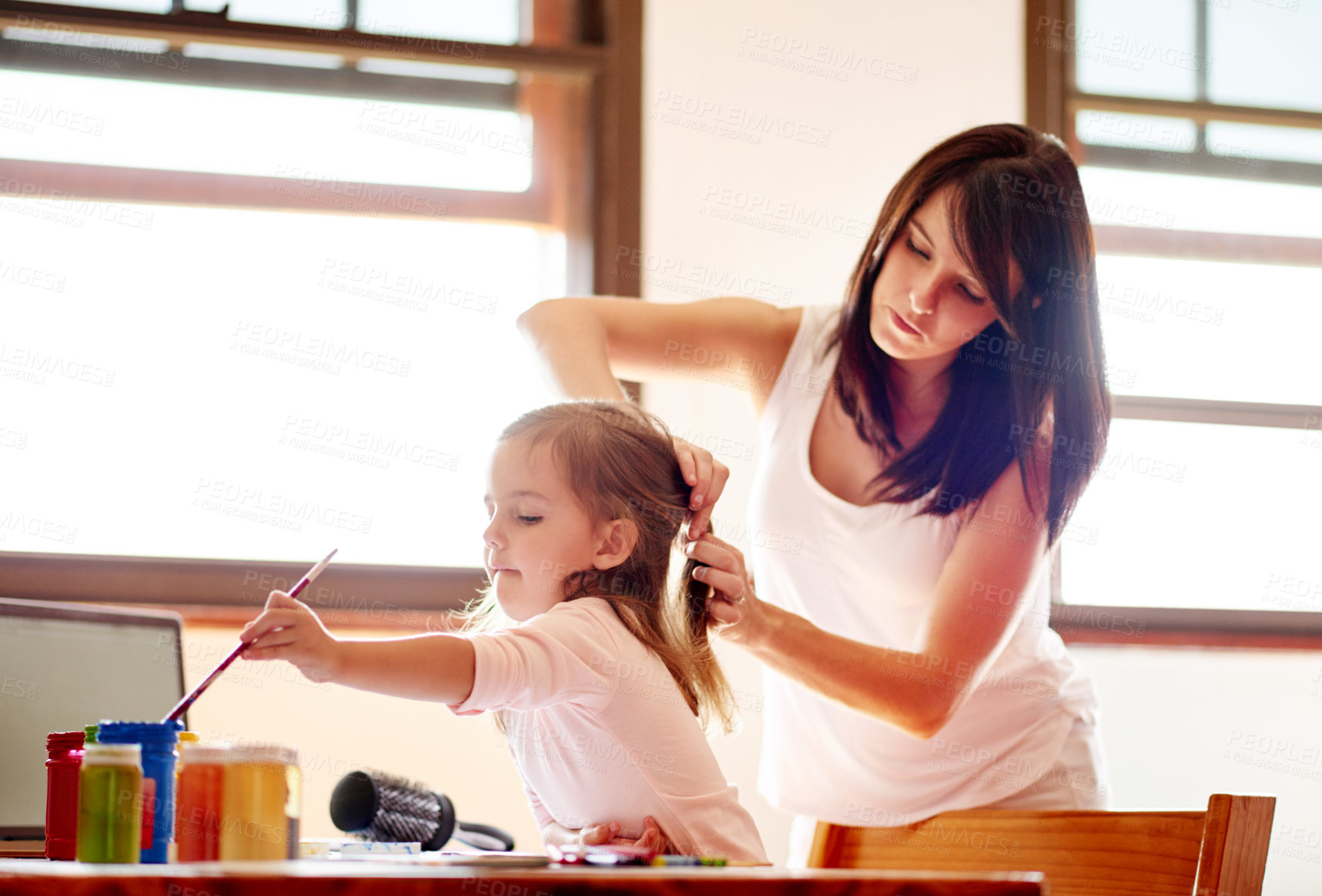 Buy stock photo Painting, mother and art with girl in house for child development, helping and education. Creative, kindergarten and sketch with kid and mom brushing hair in family home for future, youth and color