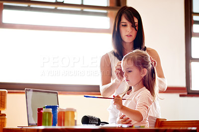 Buy stock photo Art, creative or painting with girl and mom in home together for education or learning. Family, homework and study with woman braiding hair of daughter at desk in bedroom of apartment for bonding