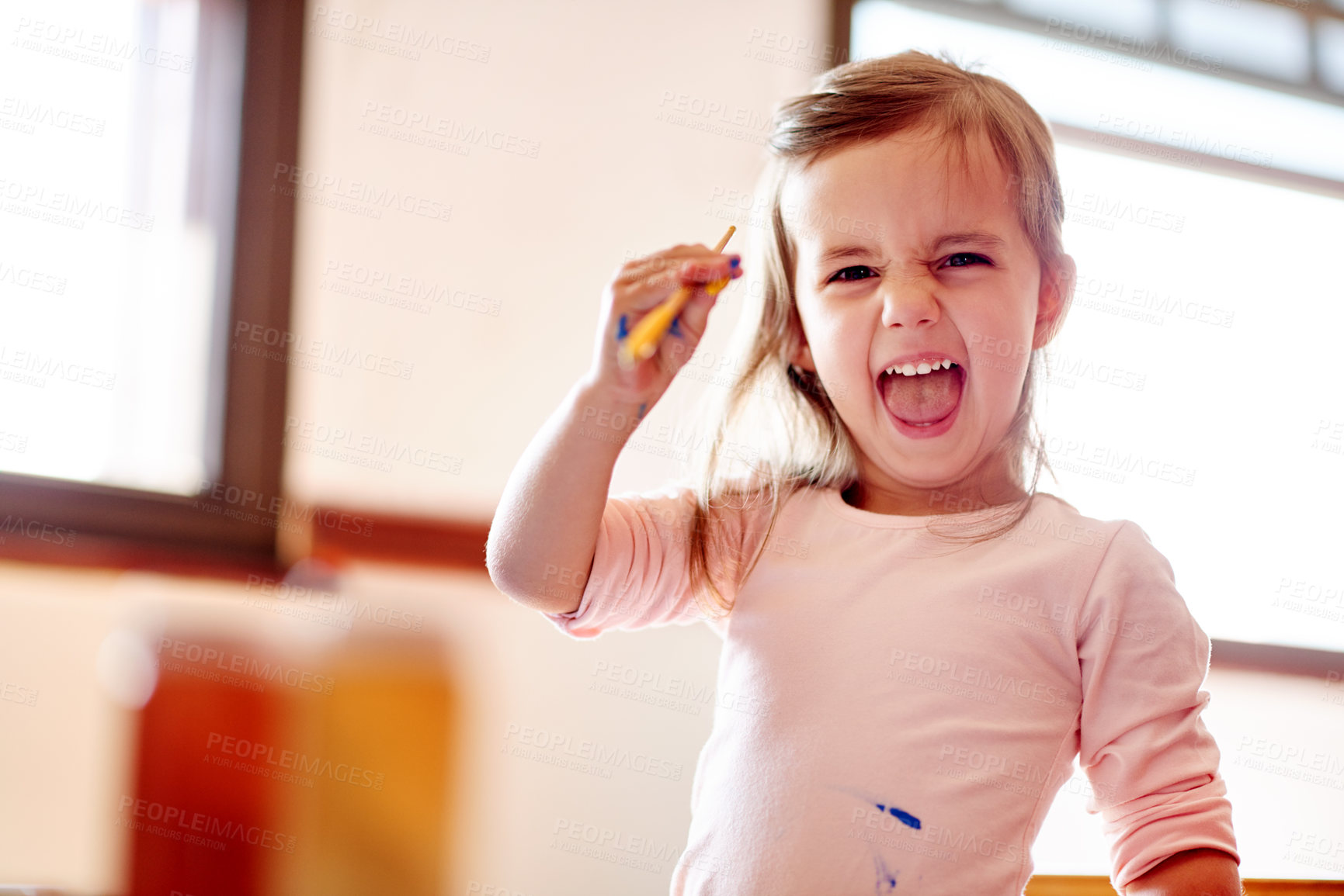 Buy stock photo Painting, mess and portrait with girl in house for child development, excited and education. Creative, kindergarten and inspiration with kid and art in family home for future, youth and funny face