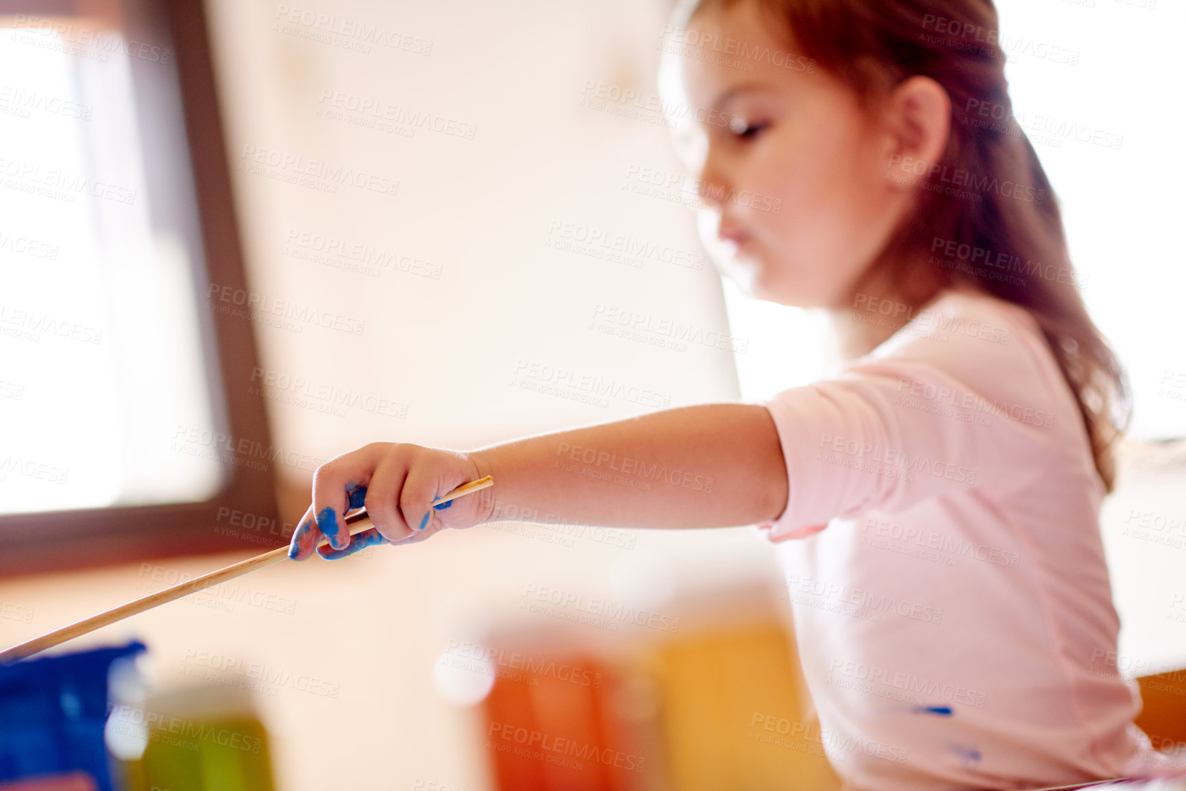 Buy stock photo Painting, mess and creative with girl in house for child development, drawing talent and education. Art, kindergarten and sketch with kid and paintbrush in family home for future, youth and color
