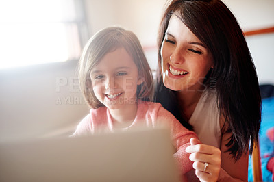 Buy stock photo Laptop, education and mother with kid in house for elearning app, kindergarten student and creative phonic skills. Child development, teaching and parent control with woman and girl in family home