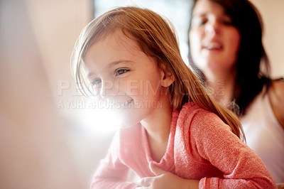 Buy stock photo Elearning, child and mom with laptop, home and streaming of educational video, growth and watching. House, woman and bonding with daughter for knowledge, online and studying for cognitive development