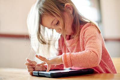 Buy stock photo Kid, student and press on tablet in classroom for streaming lesson, elearning website and drawing. Child, girl and digital with online education, reading ebook and studying application for assessment