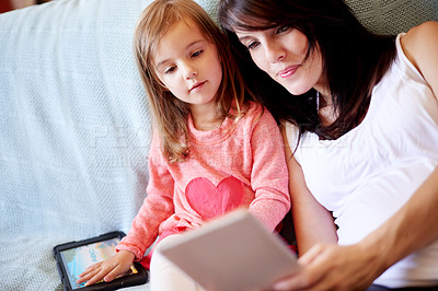 Buy stock photo Bonding, mom and child with tablet, streaming and watching cartoons for entertainment, family and home. Digital, woman and tech for movies with daughter, online or smile for videos in apartment