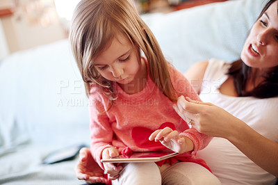 Buy stock photo Tablet, search and mother with kid in living room for elearning app, kindergarten student and creative phonic skills. Child development, teaching and parent control with woman and girl in family home