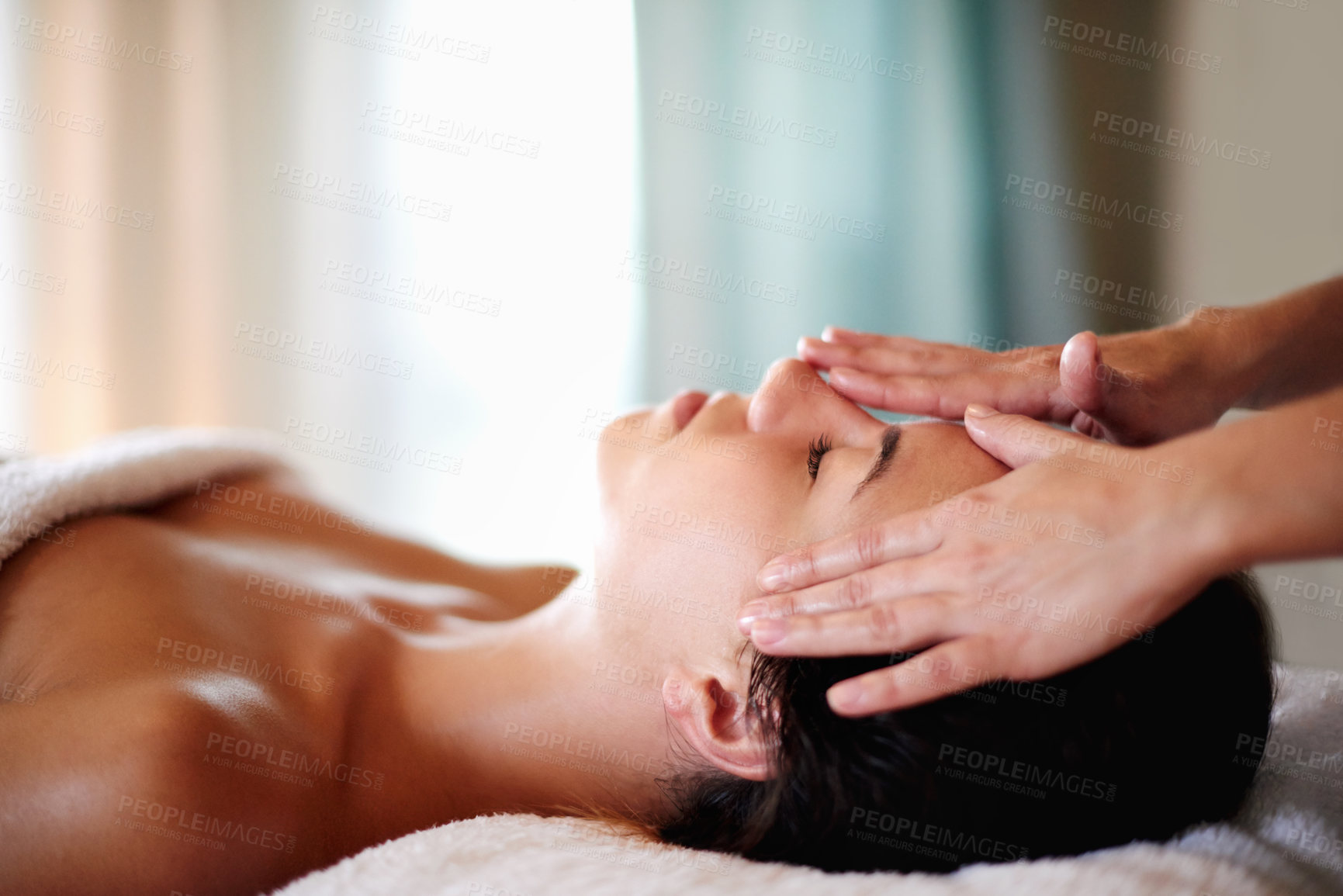 Buy stock photo Face, massage and girl on bed at salon for skincare, peace and lymphatic drainage with hotel service. Relax, self care and woman on table at beauty spa for holistic facial, wellness or skin treatment