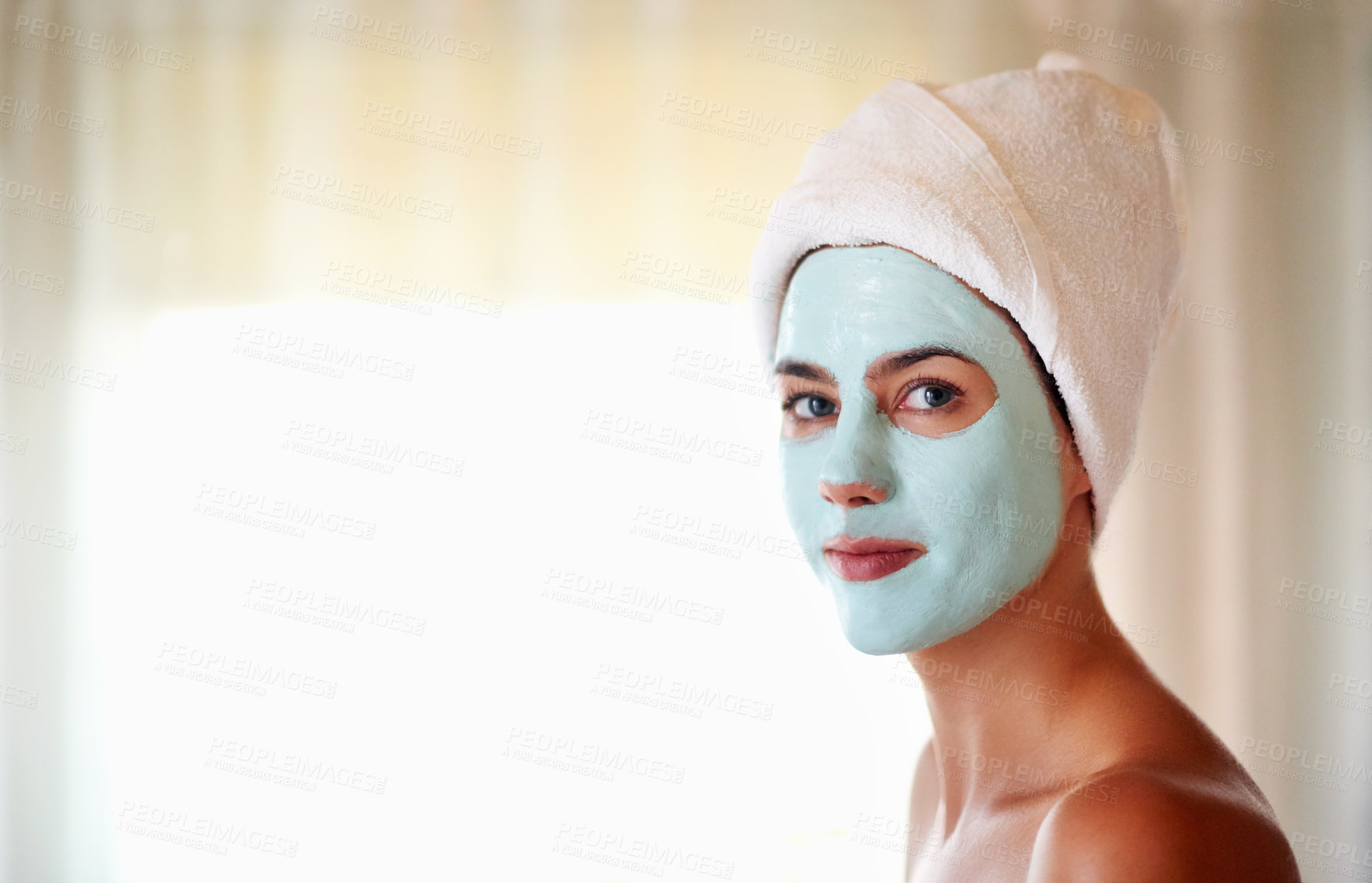 Buy stock photo Girl, spa and portrait with face mask for beauty, treatment and exfoliate with towel at luxury resort. Woman, smile and facial with cosmetics, relax or process for skincare with mockup space in Spain