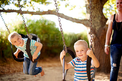 Buy stock photo Mother, swing and portrait of children in park with play, outdoor adventure and development for kids in nature. Relax, mom and boy in playground for growth, fun games and playful childhood on weekend