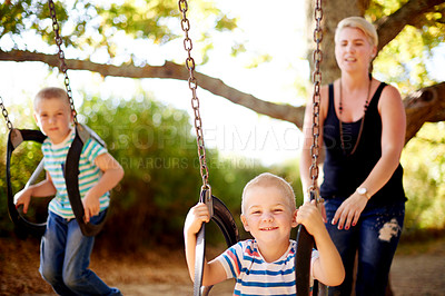 Buy stock photo Mom, swing and portrait of children in park with play, outdoor adventure and development for kids in nature. Relax, mother and boy in playground for growth, fun games and playful childhood on weekend