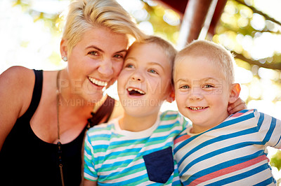 Buy stock photo Smile, nature and portrait of mother with children in park for school holiday, fun or bonding. Connection, family and mom with boy kids outdoor in field laughing for joke, comic or comedy together.