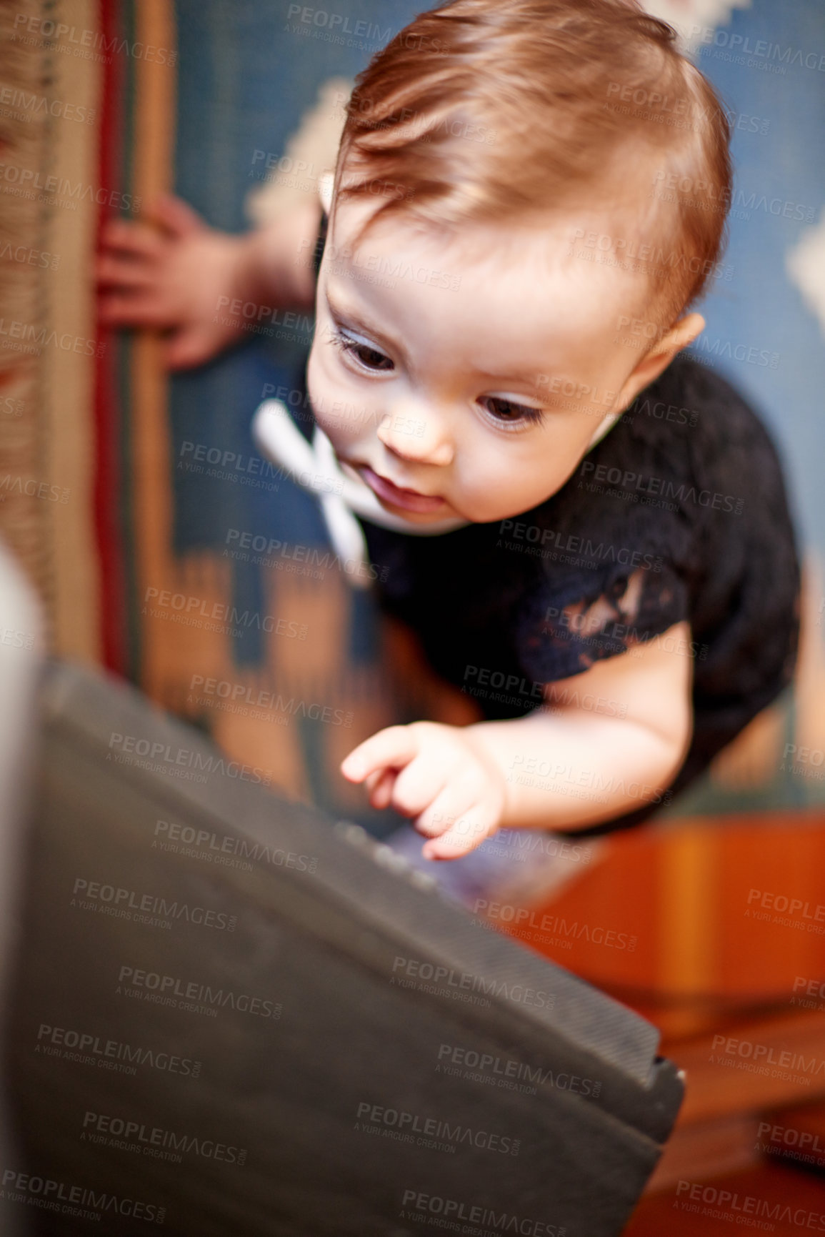 Buy stock photo Cabinet, climbing and development with baby girl in home for curiosity, discovery or growth. Balance, coordination and drawers with adorable infant child in bedroom or nursery of apartment from above