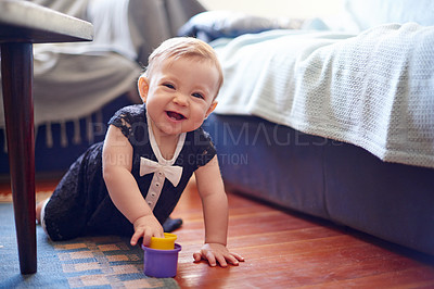 Buy stock photo Home, baby and portrait with toys for crawl, motor skills and physical development. House, happy and child with plastic cups for sensory interaction, playing and cognitive growth with curious game
