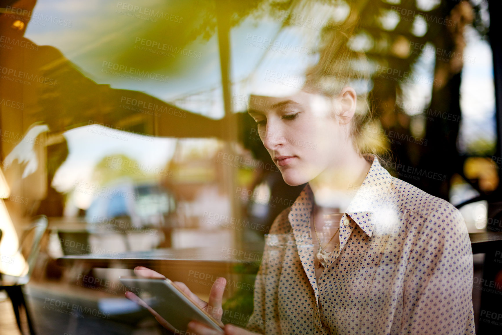 Buy stock photo Tablet, remote work and woman in cafe, reading email and editing news for politics. Coffee shop, freelancer and journalist on digital technology for online story, scroll article and report by window