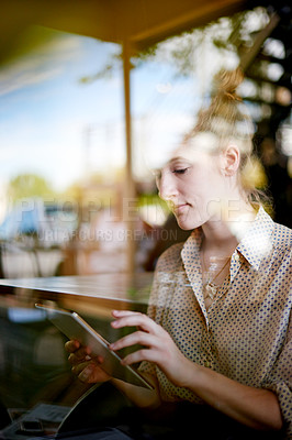 Buy stock photo Tablet, remote work and woman in cafe by window, reading email and editing news for politics. Coffee shop, freelancer and journalist on digital technology for online story, article and check report