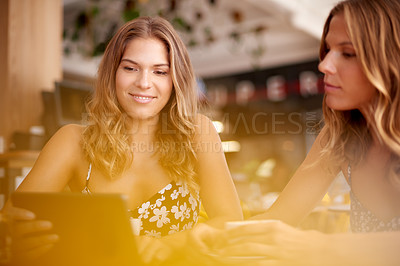 Buy stock photo Tablet, coffee shop and sisters with travel in city reading celebrity gossip blog for entertainment. Happy, cafe and twin women with digital technology posting on social media for vacation update.