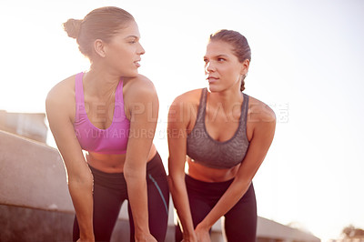 Buy stock photo Fitness, women and resting for exercise outdoor with endurance challenge, cardio workout and recovery. Twin sisters, teamwork and relax from training run, marathon competition or overworked on bridge
