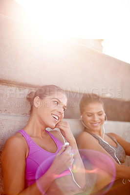 Buy stock photo Music, relax and fitness with family in city for health podcast, workout and exercise playlist. Runner, wellness and earphones with women training outdoors for sports athlete, twin sister or marathon