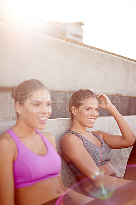 Buy stock photo City, women and rest with laughing for fitness, workout and  outdoor after running marathon. Bridge, happy people and sisters on break for exercise, training and siblings with wellness joke by flare