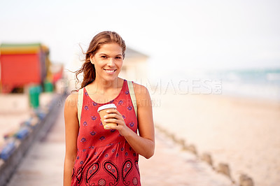 Buy stock photo Beach, woman and portrait with coffee for walking, travel destination and espresso for caffeine. Outdoor, female person and tourist with happiness for tea cup, adventure and sightseeing at seaside