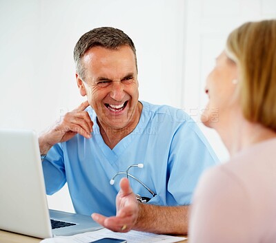 Buy stock photo Mature doctor, patient and consultation in clinic, man and laptop for diagnosis or treatment plan. Male person, laughing and advice in conversation or help, trust and physician for results of test