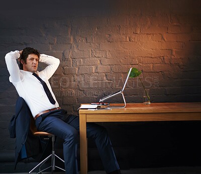 Buy stock photo Desk, thinking and man in business, night and fraud of partner, worry and anxiety in dark of office. Embezzlement, laptop and person with fear for bankruptcy of payday loan company and entrepreneur