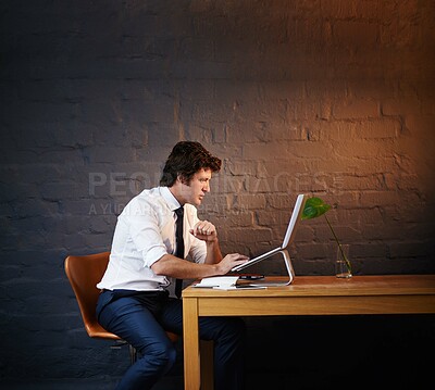 Buy stock photo Reading, laptop and businessman in office at night with report for investigation with research. Typing, computer and male detective working on criminal justice case for filing deadline by brick wall.