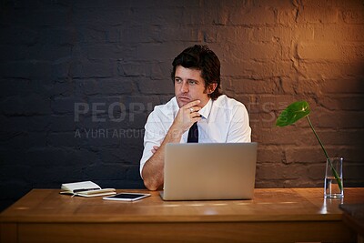 Buy stock photo Thinking, laptop and businessman in office at night working on company stocks investment. Plan, notebook and financial analyst with computer and tablet for profit, revenue or budget report deadline.