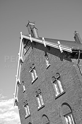 Buy stock photo Architecture, windows and church with black and white in city for religion, worship and building. Brick wall, exterior and prayer with catholic temple outdoor for God,  spiritual or cathedral