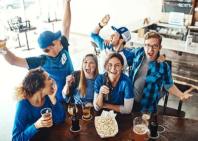 Buy stock photo Sports, celebrate and group of people in pub with high five, success or winning of football match or team victory. Friends or fans at restaurant by drinks, beer or alcohol and shout for goal or above