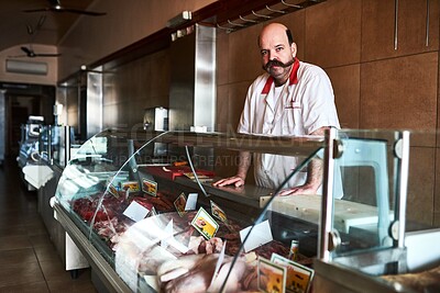 Buy stock photo Portrait, man and butcher at store, retail or small business startup with food in Italy. Work, confidence or meat seller at shop counter with serious face for inflation at market of salesman or owner