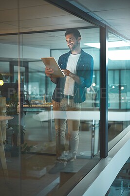 Buy stock photo Man, tablet and reading with smile, startup and inspiration with news, update and overtime at office. Person, digital touchscreen and ideas with application, contact and night at creative agency