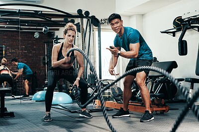 Buy stock photo Fitness, battle ropes and woman in gym, training and personal trainer with timer, energy and sweat. Health club, exercise and endurance for cardiovascular conditioning, people and wellness of workout