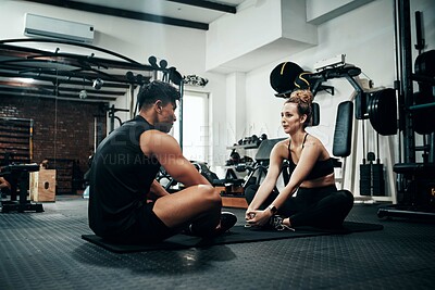 Buy stock photo Man, woman and stretching in gym for fitness, instruction and warm up for exercise. Personal trainer, girl and sitting in wellness club for physical activity, couching or support in training on floor