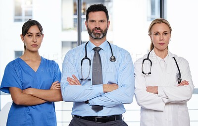 Buy stock photo Serious portrait, arms crossed and team of doctors with collaboration for healthcare service and solidarity in hospital. Cardiology employees, medicine and group with pride for workplace diversity