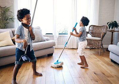 Buy stock photo Home, mop and broom with children for singing, cleaning and fun activity for entertainment in lounge. Kids, siblings and boys with household tools for playful, imaginative and bonding with chores