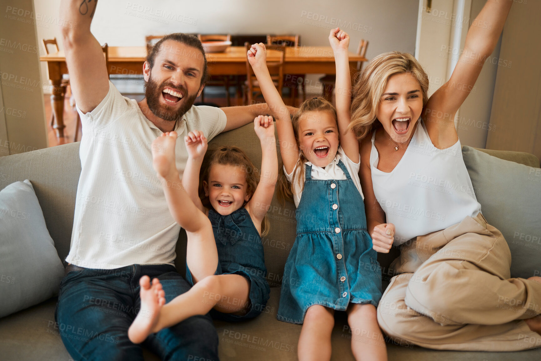 Buy stock photo Parents, children and watching tv with cheering on sofa for football goal, winning team and competition success. People, sport fans and celebration for live broadcast in home with support and bonding