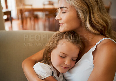 Buy stock photo Mom, kid and hug on sofa with love, healthy relationship and trust in family home. Single mother, happy daughter and embrace in living room for support, affection or proud moment in child development