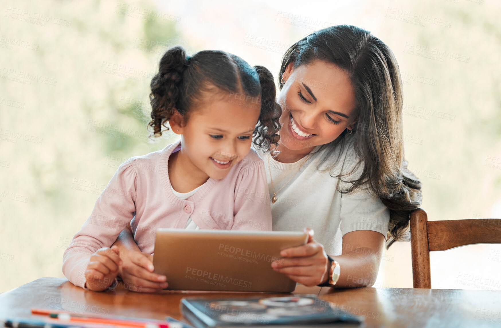 Buy stock photo Education, mom and child with tablet, home and smile for elearning with parent, reading or bonding. Studying, woman and daughter with tech for knowledge, kid or mother with help for homework in house