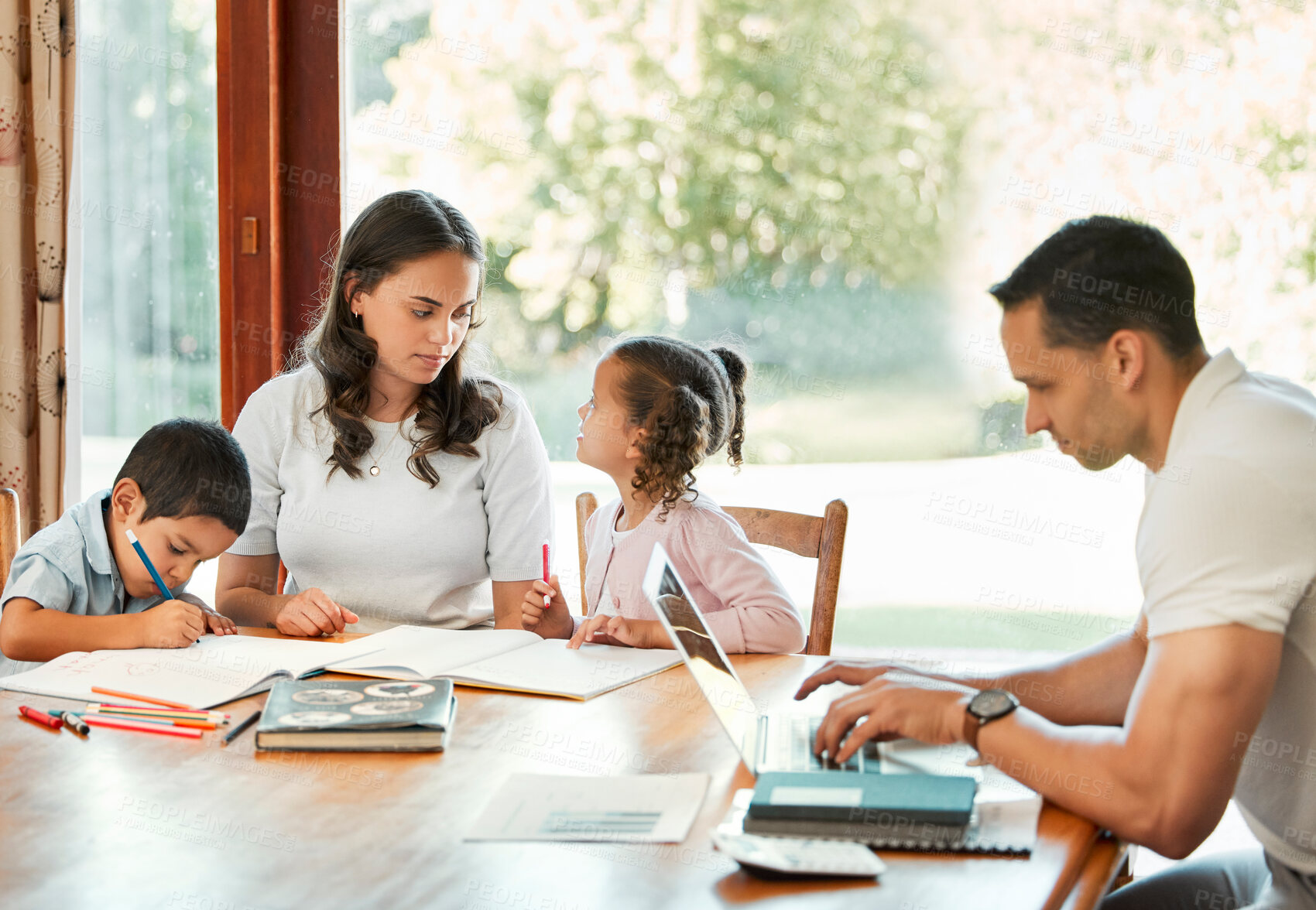 Buy stock photo Education, learning and remote work with family in dining room of home together for child development. Books, laptop or teaching with mom, dad and kids in apartment for business, help or school