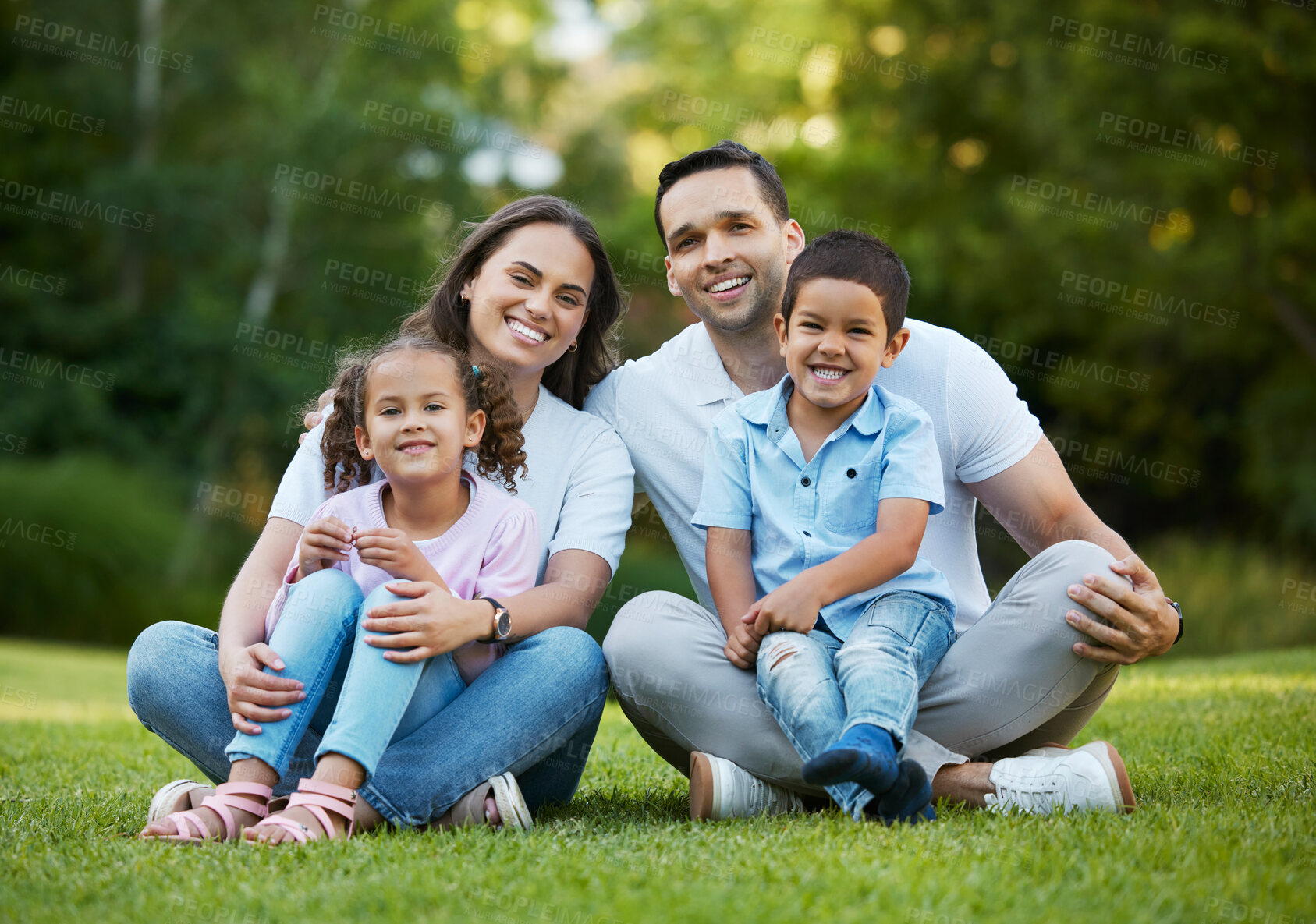 Buy stock photo Happy family, portrait and relax with hug on grass field for bonding, holiday or outdoor weekend together in nature. Mom, dad and children or siblings with smile for fun childhood on lawn at park