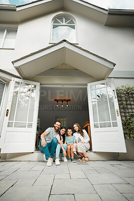 Buy stock photo Parents, kids and happy in new home for portrait, real estate opportunity and property investment. Below, couple and children at front door with relax, pride and fresh start in Spain family house