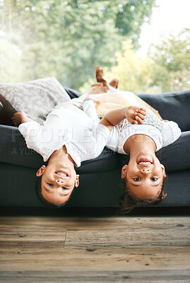 Buy stock photo Portrait, upside down and happy kids playing on sofa with smile, care or joy with games in family living room. Girl, silly boy and playful children siblings bonding on couch together in house for fun