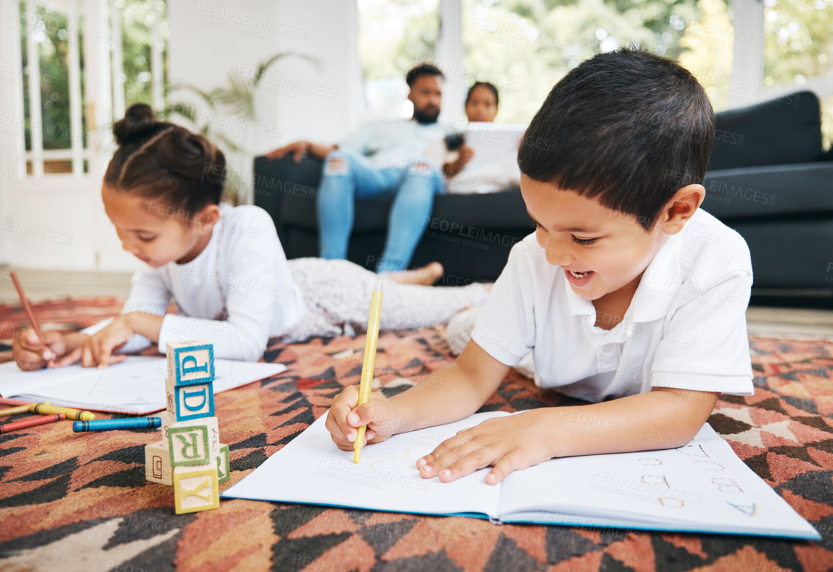 Buy stock photo Education, children and books in home for learning, language development and blocks for spelling. Kids, writing and excited in living room for growth, creativity and parents of sofa for childcare