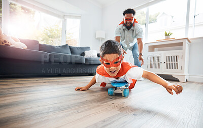 Buy stock photo Father, child and superhero costume in home for flying on skateboard or playing fantasy games together. Dad, boy and happy kid in cosplay character mask for bonding in living room in family house