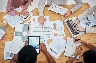 Buy stock photo Meeting, planning and finance with a group or team of business people discussing data, a contract or financial report from above. Overhead of a boardroom meeting for strategy, growth and development