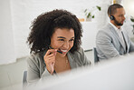 Young happy mixed race female call center agent answering calls while wearing a headset at work. Hispanic businesswoman with a curly afro talking on a call while working on a desktop computer at a desk in an office