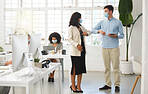 Diverse colleagues talking and greeting each other with their elbows while wearing masks to protect from infection of a virus. Young caucasian businessman talking to an african american businesswoman while working a digital tablet in an office