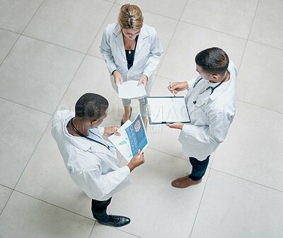 Buy stock photo Top view, healthcare and doctors talking, brainstorming and share information. Medical professionals, men and woman with tablet, reports and conversation for surgery process in hospital and schedule.