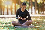 Fitness, phone and woman with watch in nature to track training time, workout schedule and progress in Australia. Communication, health and athlete with mobile and smart watch for exercise in a park