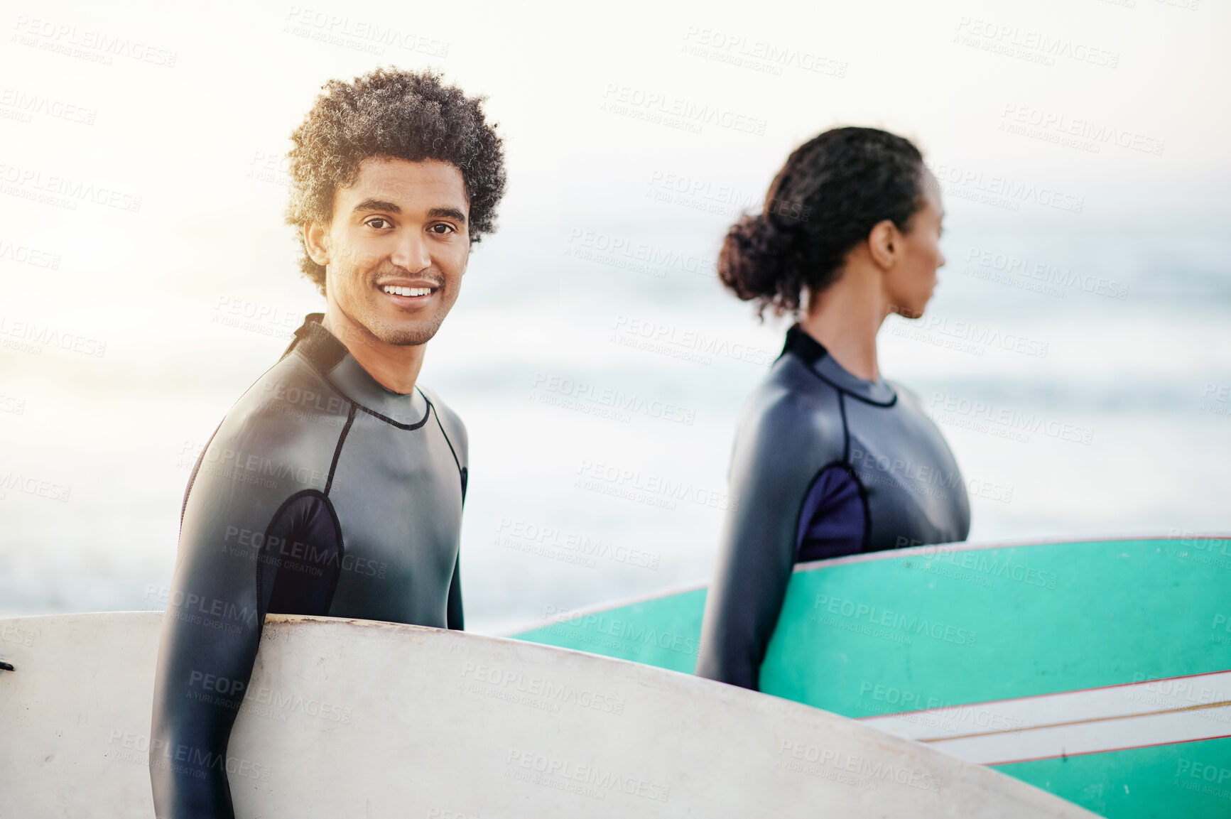 Buy stock photo Portrait, sports and a surfing man on the beach with a friend during summer for fun or recreation. Surfboard, water or workout with a man and woman surfer walking in the ocean for training or leisure
